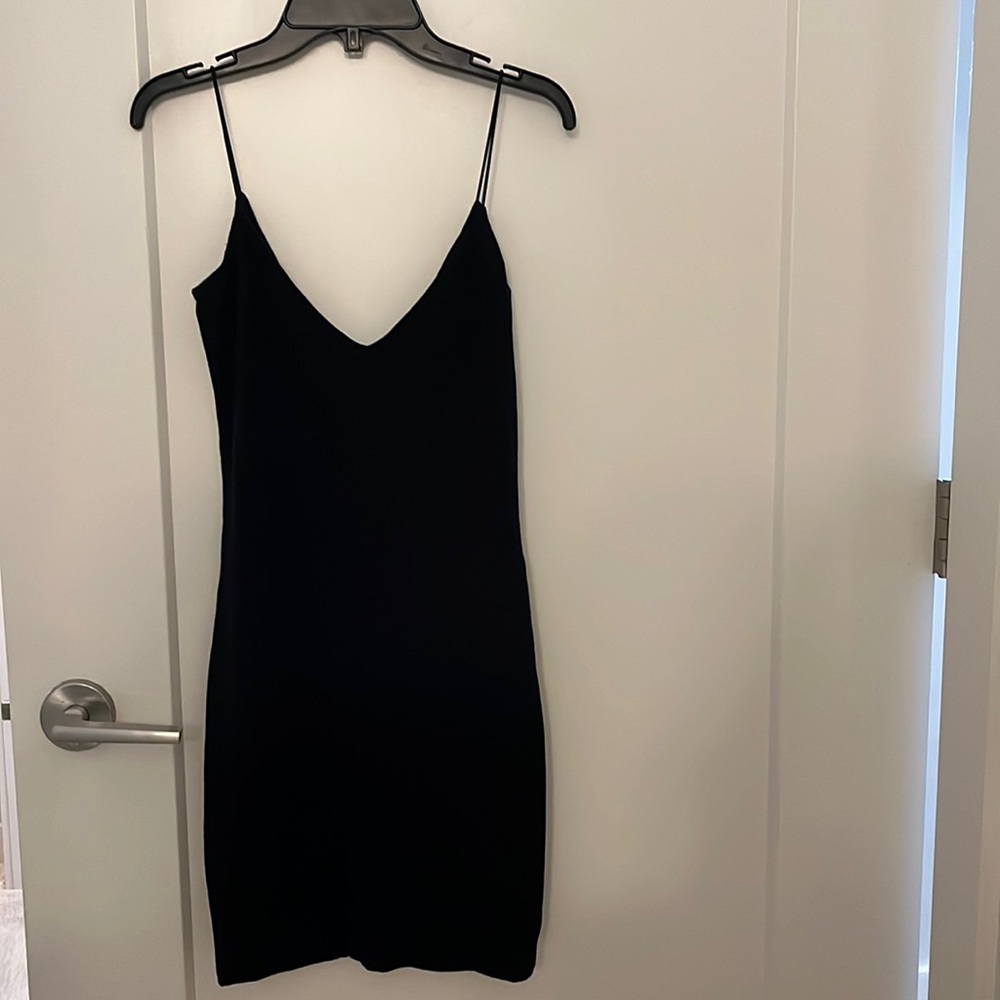 The perfect LBD by Wilfred. Black, mini, v neck and v back, spaghetti strap.